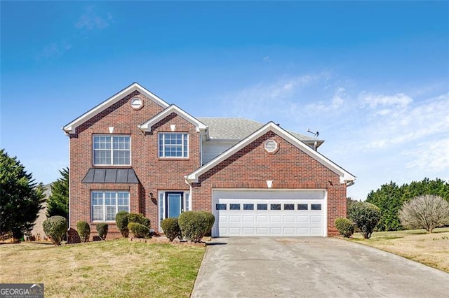 traditional-style home featuring an attached garage, driveway, brick siding, and a front yard