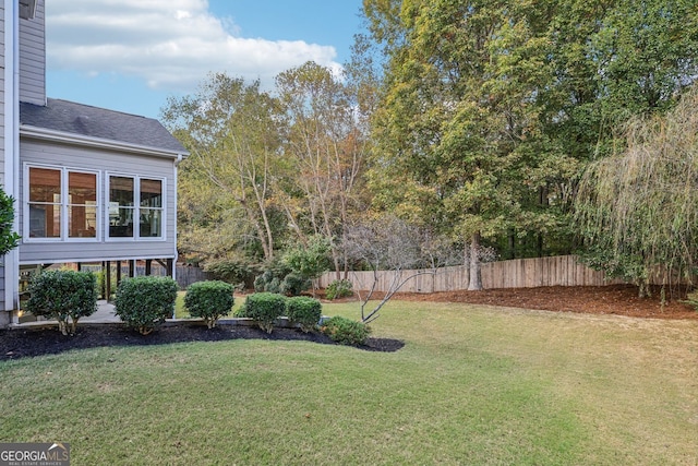 view of yard featuring fence