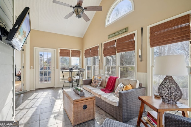 sunroom with lofted ceiling and ceiling fan