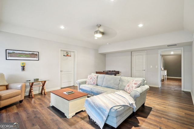 living room featuring baseboards, visible vents, dark wood-style flooring, and recessed lighting