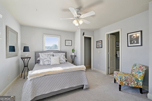 carpeted bedroom featuring baseboards and a ceiling fan