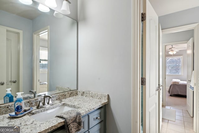 bathroom featuring ensuite bath, tile patterned flooring, and vanity