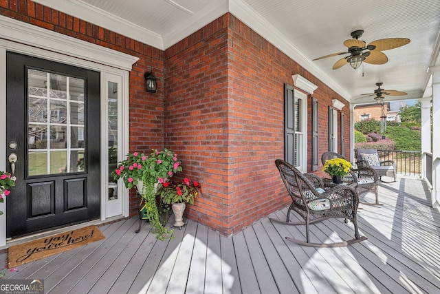 deck featuring a porch and a ceiling fan