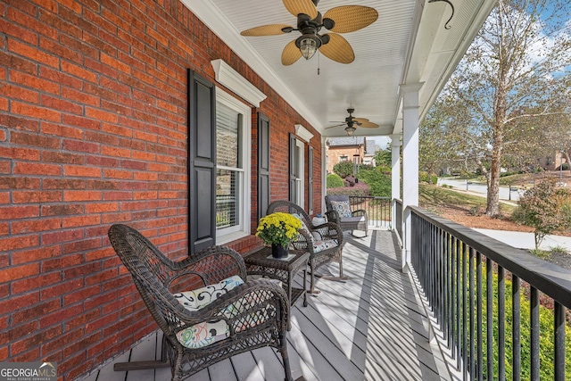 deck with ceiling fan and a porch