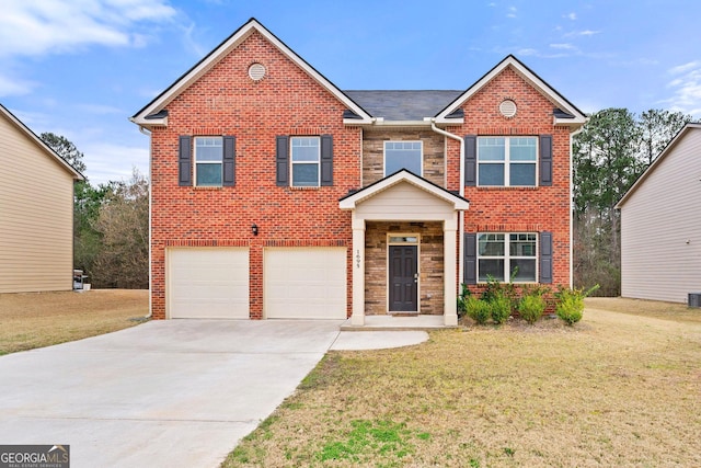 view of front of house with driveway, brick siding, a front lawn, and an attached garage