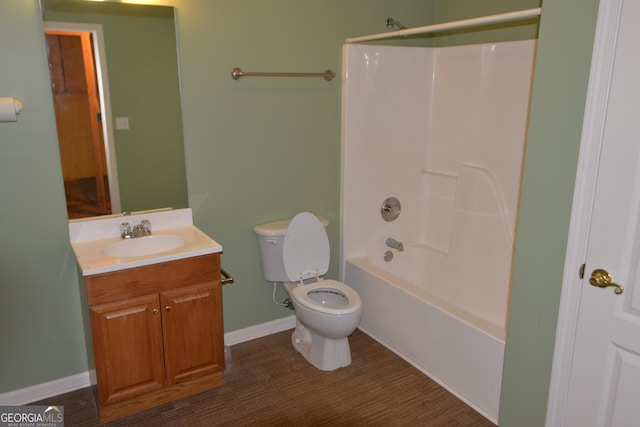 bathroom featuring toilet, shower / tub combination, vanity, and baseboards