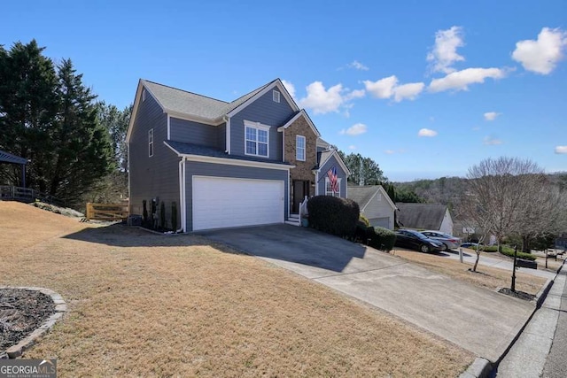 traditional-style home with driveway, an attached garage, and a front yard