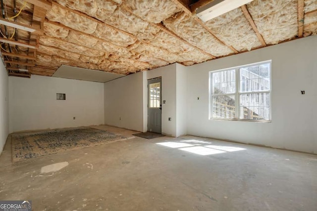 interior space with unfinished concrete flooring