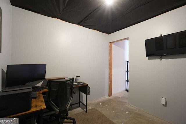 office area with concrete flooring