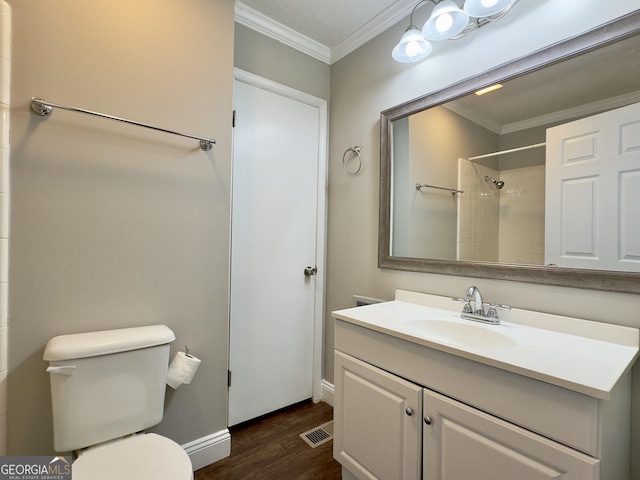 full bathroom featuring ornamental molding, visible vents, toilet, and wood finished floors