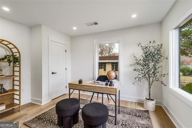 office with recessed lighting, visible vents, baseboards, and wood finished floors