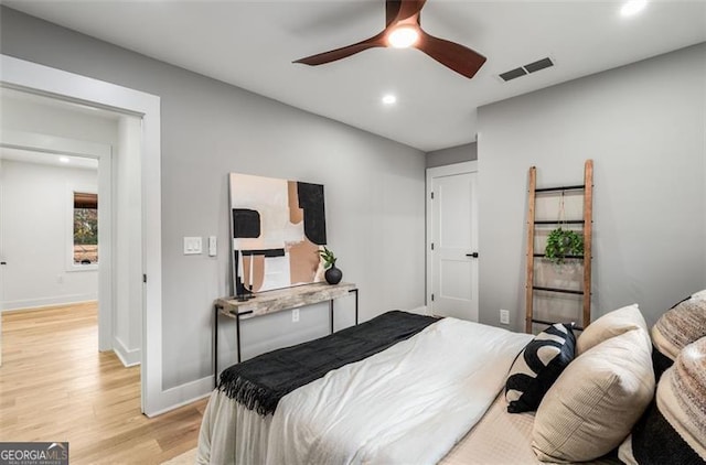 bedroom with recessed lighting, a ceiling fan, visible vents, baseboards, and light wood finished floors