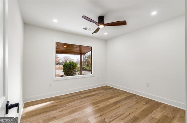 unfurnished room with recessed lighting, visible vents, a ceiling fan, light wood-type flooring, and baseboards