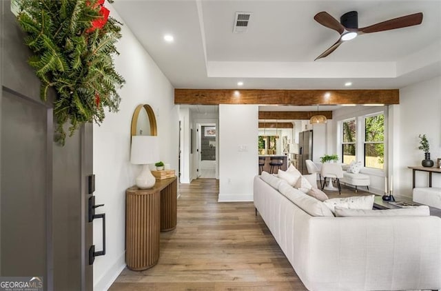 living room featuring ceiling fan, recessed lighting, wood finished floors, visible vents, and baseboards