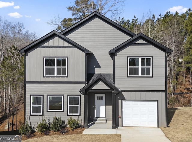 view of front of home featuring a garage, driveway, and board and batten siding