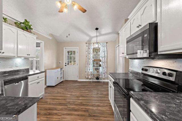 kitchen with decorative light fixtures, dark wood finished floors, tasteful backsplash, appliances with stainless steel finishes, and white cabinets