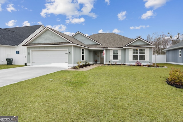 view of front of property with driveway, an attached garage, fence, board and batten siding, and a front yard