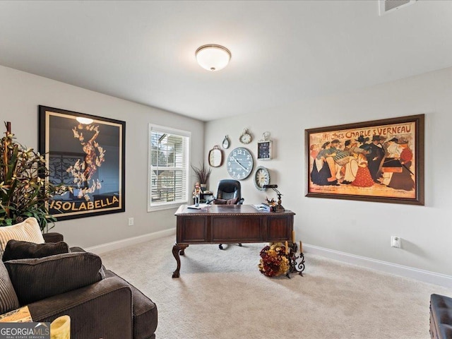 home office with carpet floors and baseboards