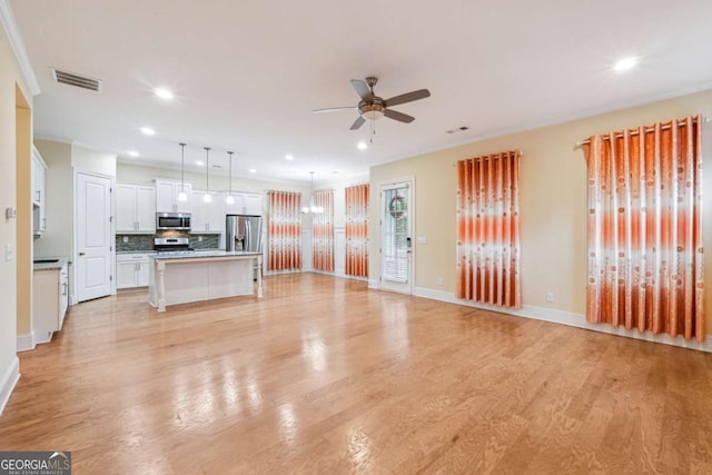 unfurnished living room with a ceiling fan, recessed lighting, visible vents, and light wood-style floors