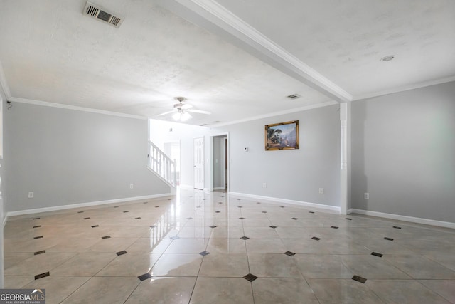 unfurnished room featuring baseboards, light tile patterned floors, visible vents, and crown molding