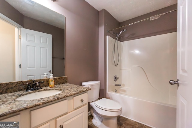 bathroom with toilet, tub / shower combination, and vanity