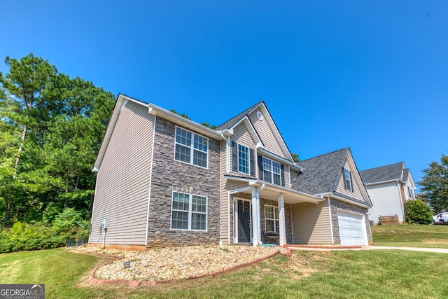 view of front of property featuring a garage, stone siding, a front lawn, and concrete driveway