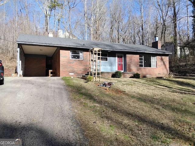 single story home with driveway, brick siding, crawl space, and a chimney