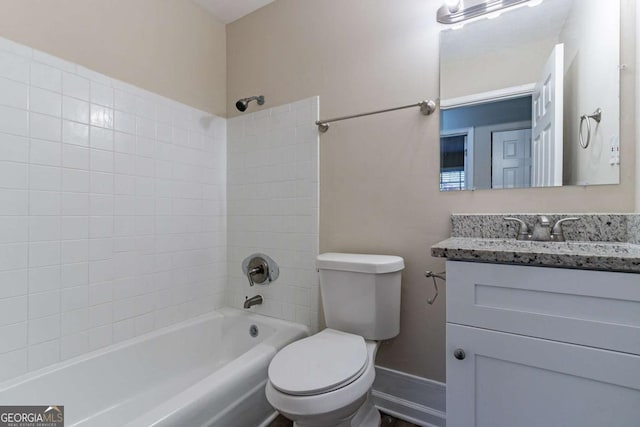 full bathroom featuring vanity, shower / tub combination, toilet, and baseboards