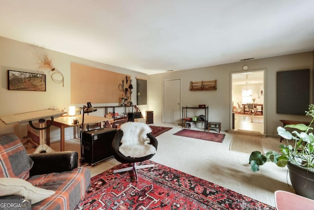 carpeted living area featuring visible vents