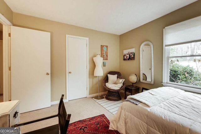 bedroom featuring carpet flooring and baseboards