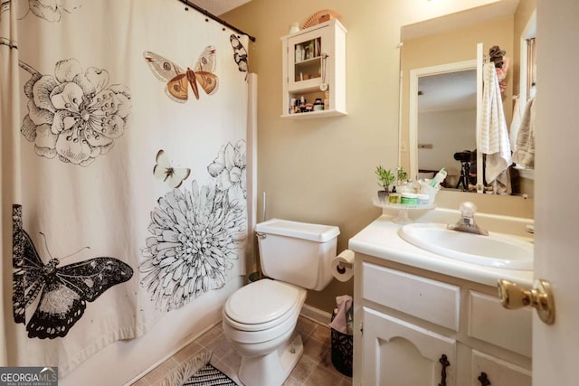 full bath with tile patterned flooring, toilet, vanity, and shower / tub combo