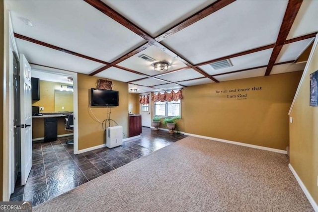 unfurnished living room featuring coffered ceiling, visible vents, and baseboards