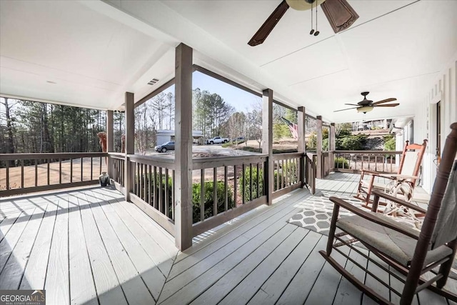 wooden deck with a porch and ceiling fan