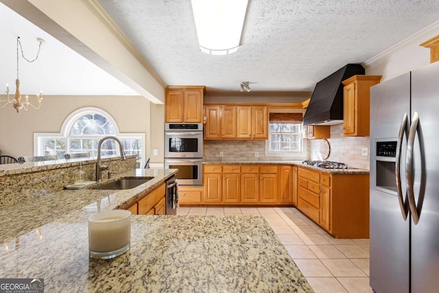 kitchen with light tile patterned floors, stainless steel appliances, a sink, ornamental molding, and custom range hood