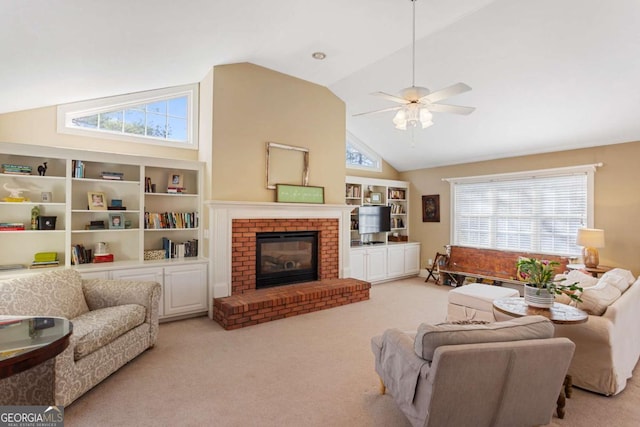 living room with high vaulted ceiling, a brick fireplace, light colored carpet, and ceiling fan