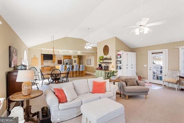 carpeted living room featuring ceiling fan, vaulted ceiling, and baseboards