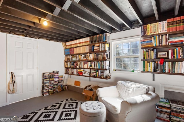 sitting room with finished concrete flooring