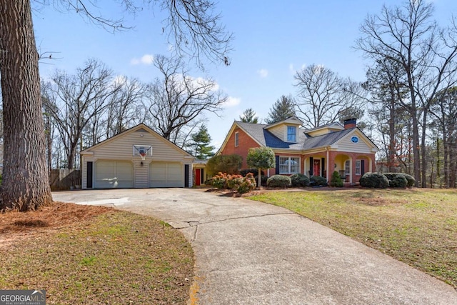 view of front of property with covered porch, an outdoor structure, a chimney, and a front lawn