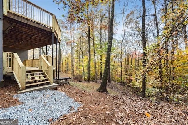 view of yard with stairs and a wooden deck