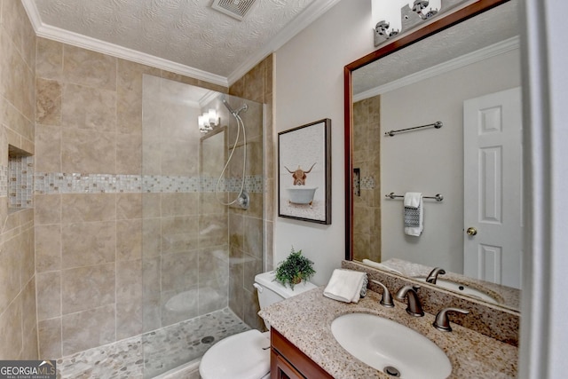 full bathroom with toilet, a tile shower, visible vents, and crown molding