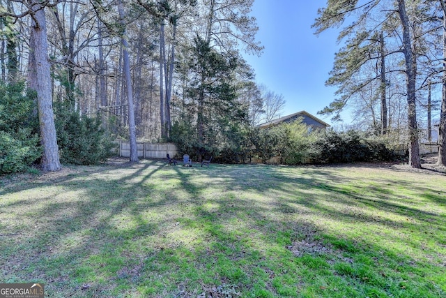 view of yard with fence