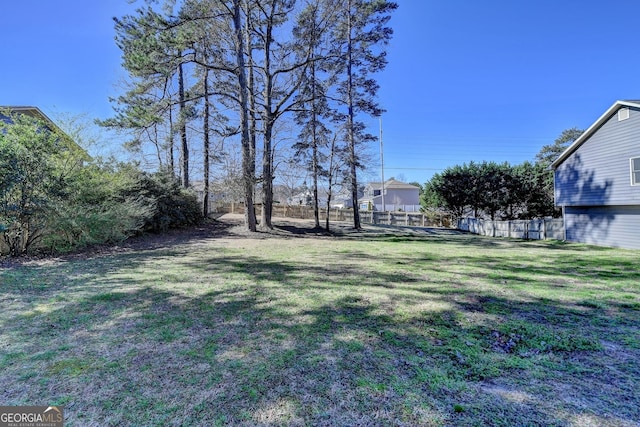 view of yard featuring fence