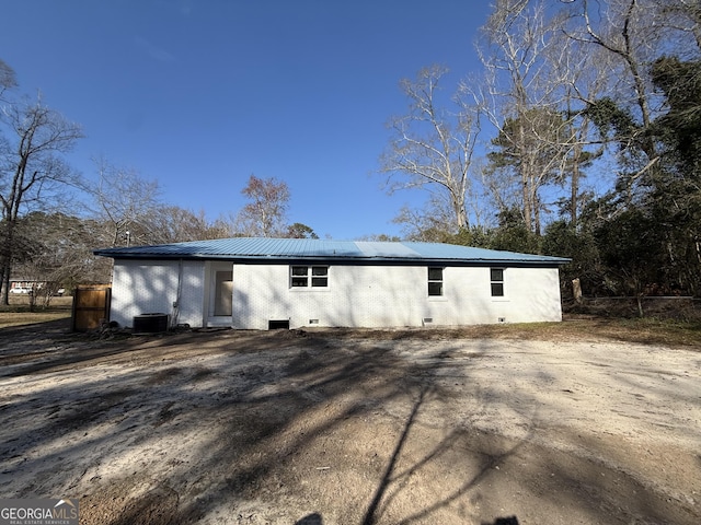 exterior space featuring cooling unit and fence