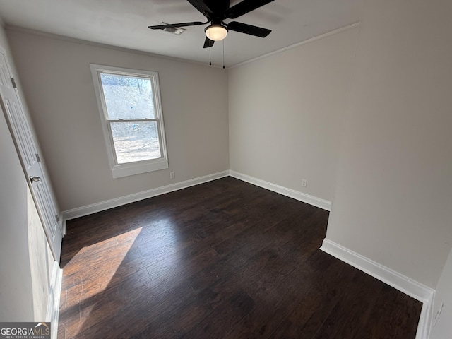 unfurnished bedroom featuring ceiling fan, baseboards, dark wood-style flooring, and ornamental molding