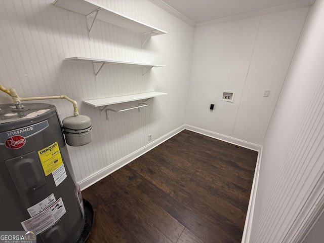 clothes washing area featuring dark wood finished floors, crown molding, hookup for a washing machine, water heater, and laundry area