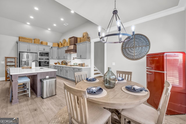 dining room featuring recessed lighting, visible vents, stairs, light wood-type flooring, and an inviting chandelier