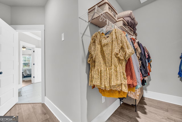 spacious closet with wood finished floors