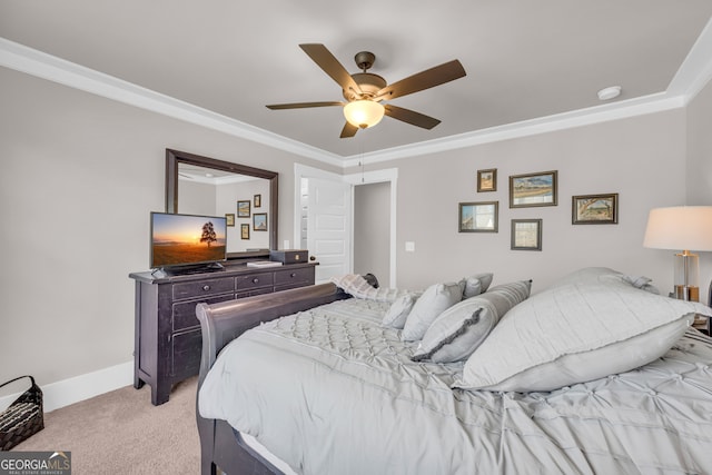 bedroom with light carpet, a ceiling fan, baseboards, and crown molding