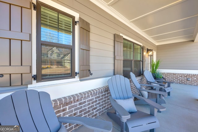 view of patio featuring a porch