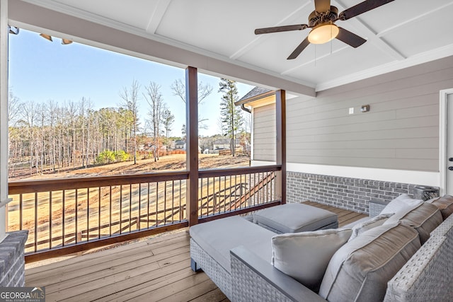 deck featuring an outdoor hangout area and a ceiling fan